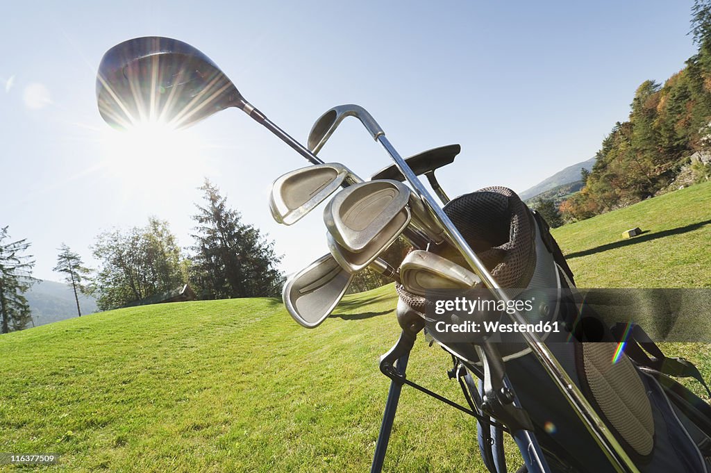 Italy, Kastelruth, Golf clubs in golf bag on golf course