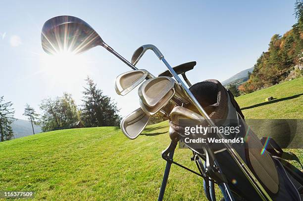 italy, kastelruth, golf clubs in golf bag on golf course - golf bag stock pictures, royalty-free photos & images
