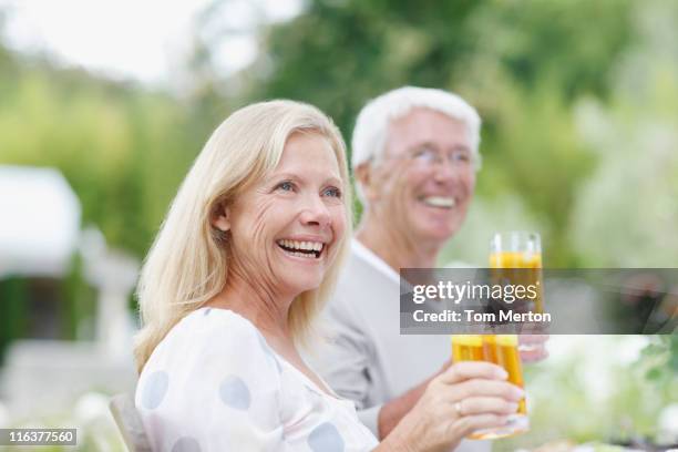 senior couple drinking iced tea - ice tea stock pictures, royalty-free photos & images