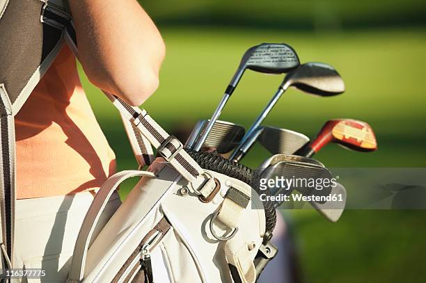 italy, kastelruth, mid adult woman with golf bag, close up - golf bag stock pictures, royalty-free photos & images