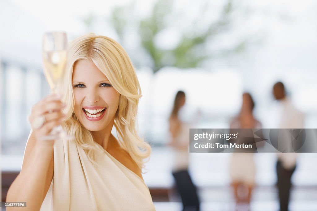 Portrait of woman holding champagne flute