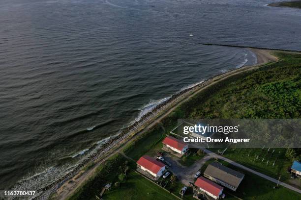 Homes sit next to the Gulf of Mexico in Grand Isle, the only inhabited barrier island in Louisiana on August 24, 2019 in Grand Isle, Louisiana....