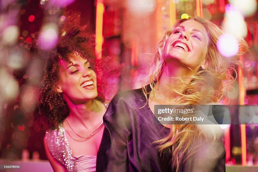 Friends dancing in nightclub