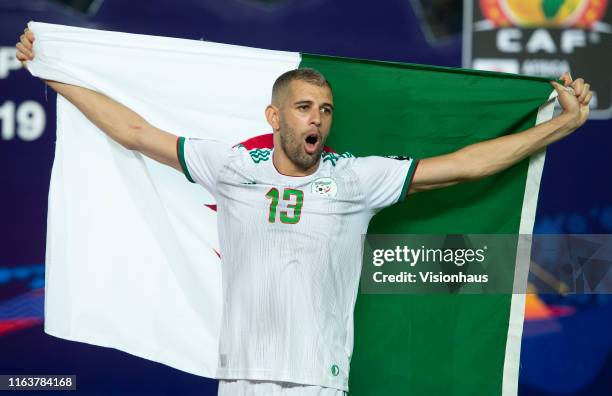 Islam Slimani of Algeria celebrates winning the 2019 Africa Cup of Nations Final between Senegal and Algeria at at the Cairo International Stadium on...