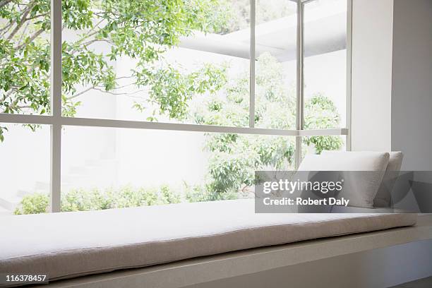 window seat - bay window interior stock pictures, royalty-free photos & images