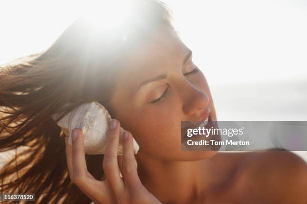 Sea Shell In Ear Shape 217 Seashell Ear Stock Photos, High-Res Pictures, and Images - Getty Images