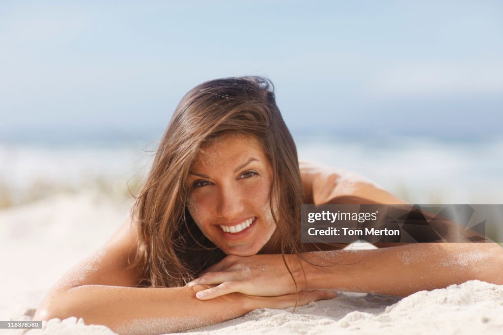 Woman laying on beach