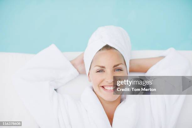 woman laying poolside - wrapped in a towel stock pictures, royalty-free photos & images