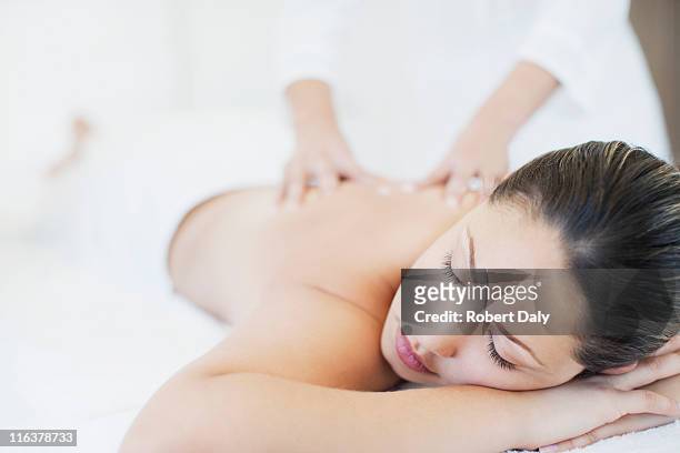 woman receiving massage - massaging stock pictures, royalty-free photos & images