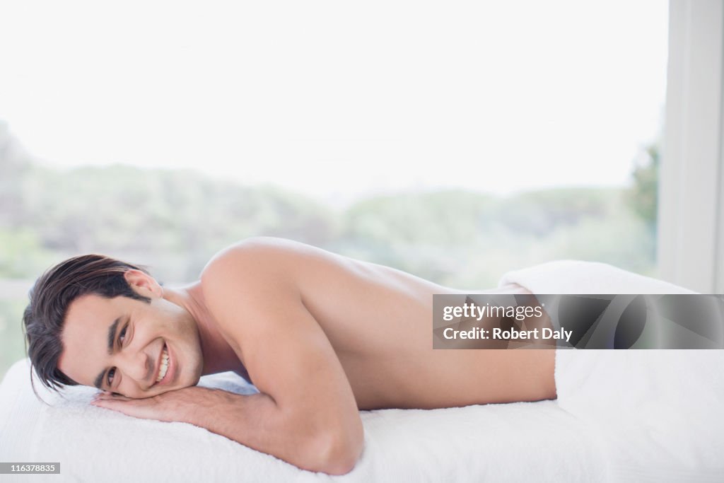 Man laying on massage table