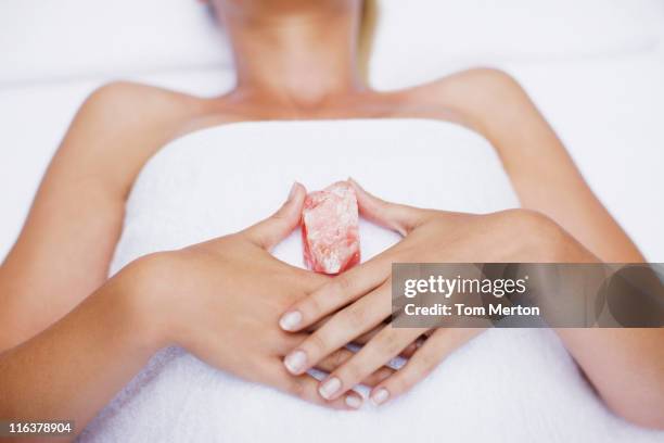 woman laying with crystal - crystal ly stock pictures, royalty-free photos & images