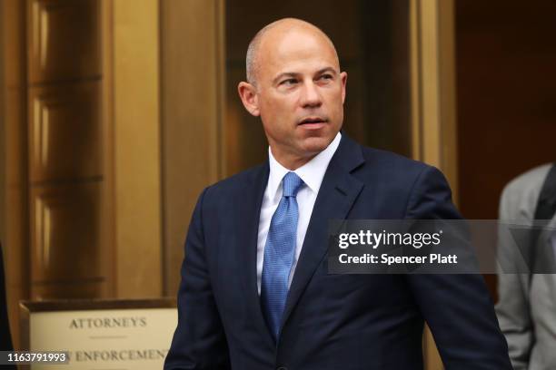 Celebrity attorney Michael Avenatti walks out of a New York court house after a hearing in a case where he is accused of stealing $300,000 from a...