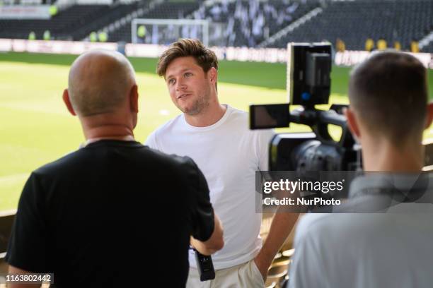 Rams supporter and One Direction singer, Niall Horan being interviewed ahed of the Sky Bet Championship match between Derby County and West Bromwich...