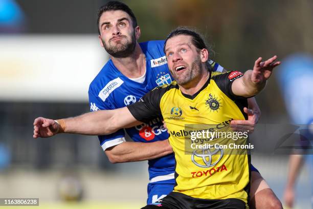 Bradley Norton of South Melbourne and Tom Cahill of Heidelberg United watch the ball during the Victoria NPL match between Heidelberg United FC and...