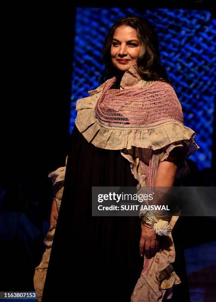 Indian Bollywood actress Shabana Azmi presents a creation by designer Kaveri at Lakme Fashion Week Winter/Festive 2019 in Mumbai on August 25, 2019....