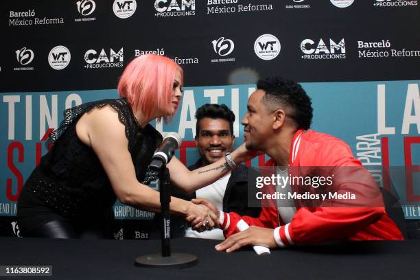 Annette Moreno greets Roberts Green and Janiel Ponciano of Barak during a press conference on July 23, 2019 in Mexico City, Mexico.