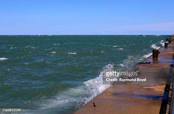 High winds continue to push the waters of Lake Michigan over the base of the Grand Ballroom at Navy Pier in Chicago, Illinois on July 22, 2019.