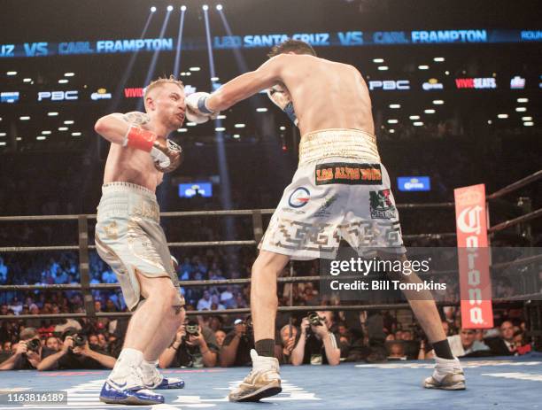 July 30: MANDATORY CREDIT Bill Tompkins/Getty Images Carl Frampton defeats Leo Santa Cruz in their Featherweight Cahmpionship fight at the Barclay...
