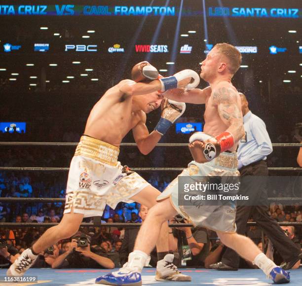 July 30: MANDATORY CREDIT Bill Tompkins/Getty Images Carl Frampton defeats Leo Santa Cruz in their Featherweight Cahmpionship fight at the Barclay...