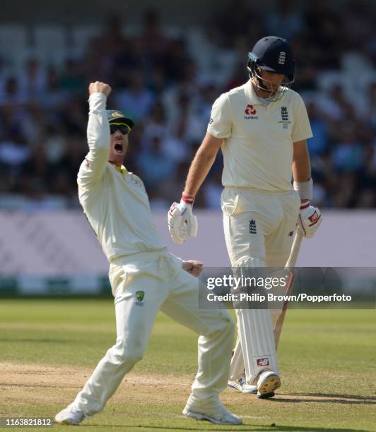 David Warner of Australia celebrates after catching Joe Root of England during the third Specsavers test match between England and Australia at...