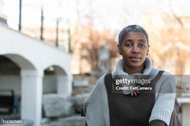 contemplative elderly woman - medicaid stock pictures, royalty-free photos & images