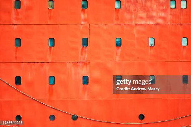 bright safety orange icebreaker ship hull - ice breaker stock pictures, royalty-free photos & images
