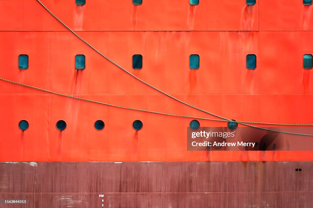 Bright safety orange icebreaker ship hull