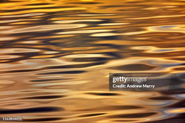 water ripple wave patterns with reflections - sunset water stock pictures, royalty-free photos & images