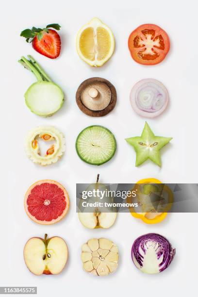 cross section of vegetables and fruits. - cross section stock-fotos und bilder