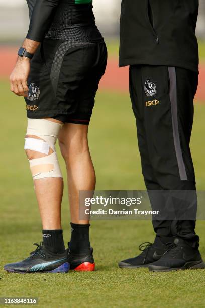 The heavy bandage of Daniel Wells is seen during a Collingwood AFL training session at Holden Centre on July 24, 2019 in Melbourne, Australia.