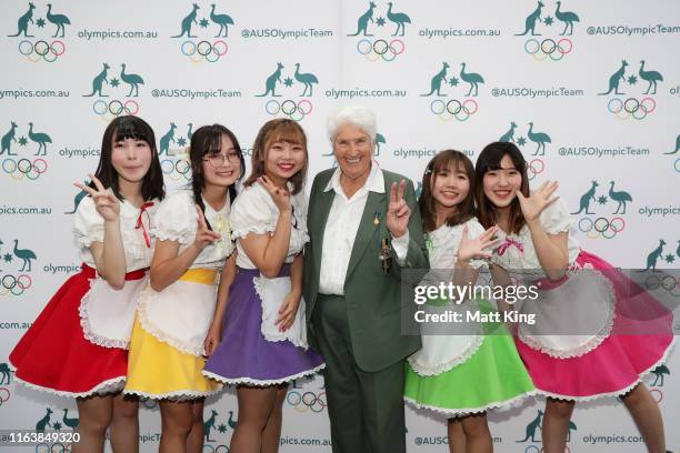 Australian Olympian Dawn Fraser poses with Japanese Kawaii dancers during the Australian Olympic Committee Tokyo 2020 Media Event at Qantas...