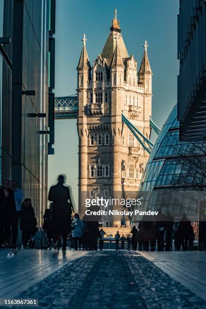 long distance view towards tower bridge in city of london, england - creative stock image - tower bridge stock pictures, royalty-free photos & images