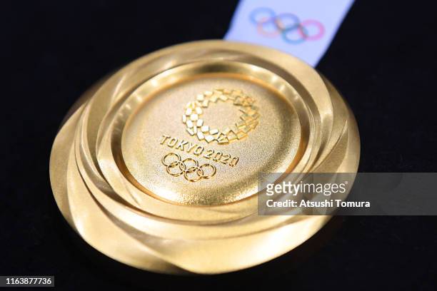 The gold medal is displayed after the Tokyo 2020 medal design unveiling ceremony during Tokyo 2020 Olympic Games "One Year To Go" ceremony at Tokyo...