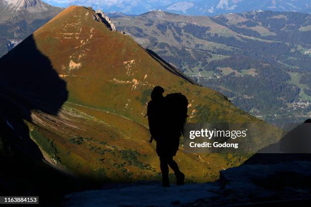 Silhouette of a mountain hiker. Mont Blanc Massif, French Alps. France.