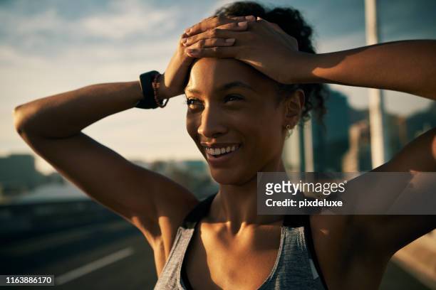 running makes me feel exhilarated - arms raised sunrise stock pictures, royalty-free photos & images