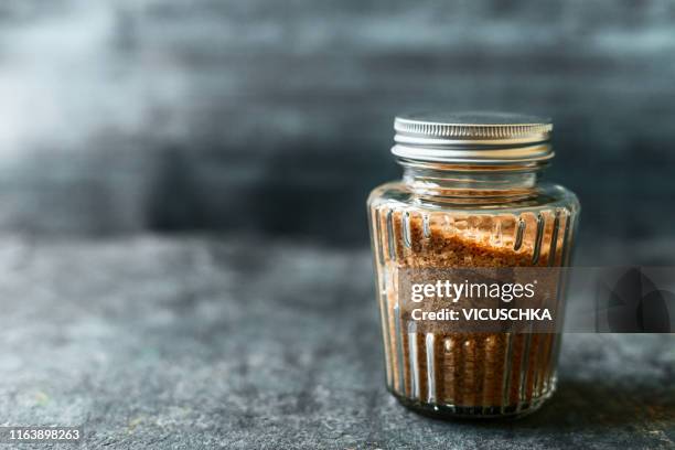 vintage storage glass jar with raw cane sugar - turbinadosocker bildbanksfoton och bilder