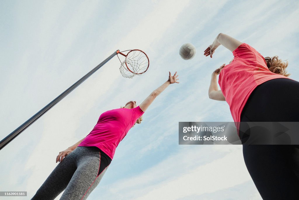 Netbol Two Women Play A Netball Game High-Res Stock Photo - Getty Images