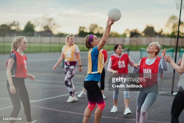 about to score a netball goal! - netball court stock pictures, royalty-free photos & images