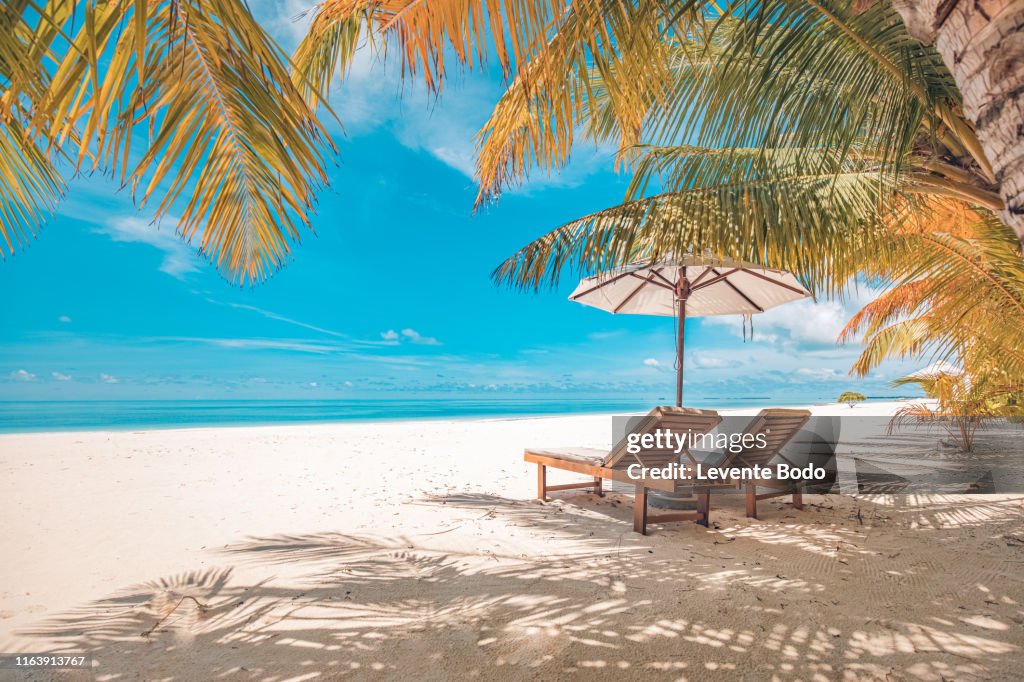 Beautiful beach. Chairs on the sandy beach near the sea. Summer holiday and vacation concept for tourism. Inspirational tropical landscape