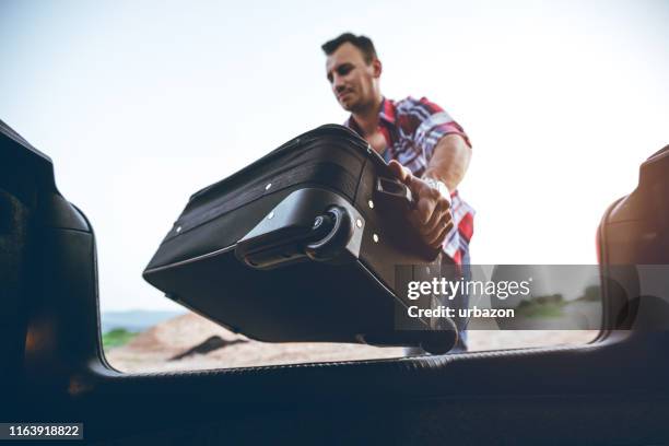 136 Man Putting Luggage In Car Stock Photos, High-Res Pictures, and ...