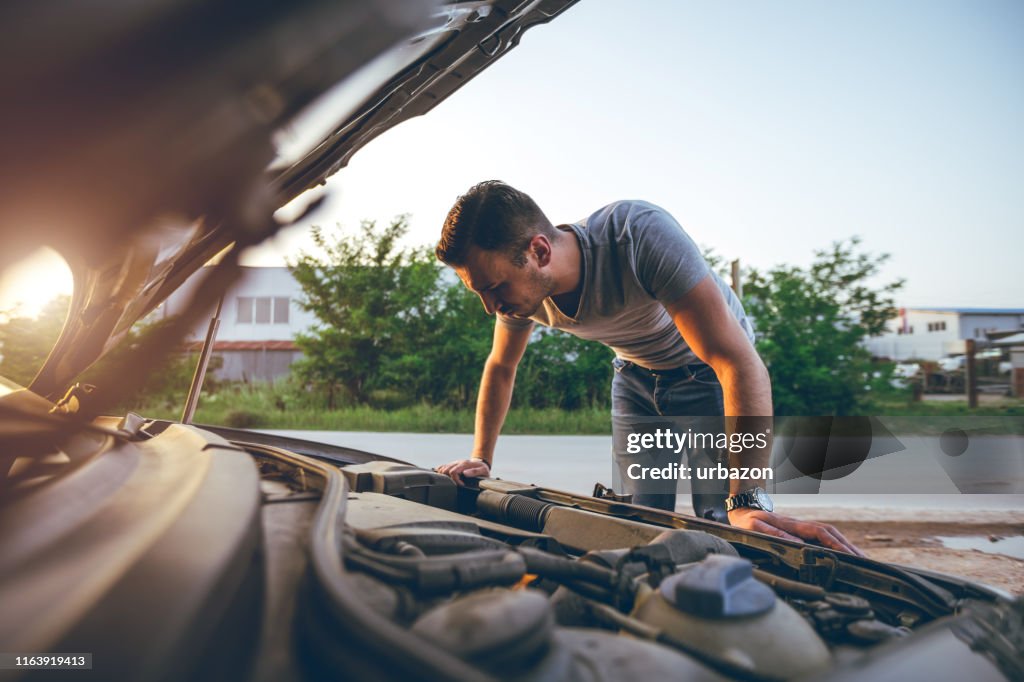 Looking under car hood