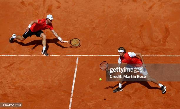 Alexander Zverev and Mischa Zverev of Germany in action against Julian Lenz and Daniel Masur of Germany during day three of the Hamburg Open 2019 at...