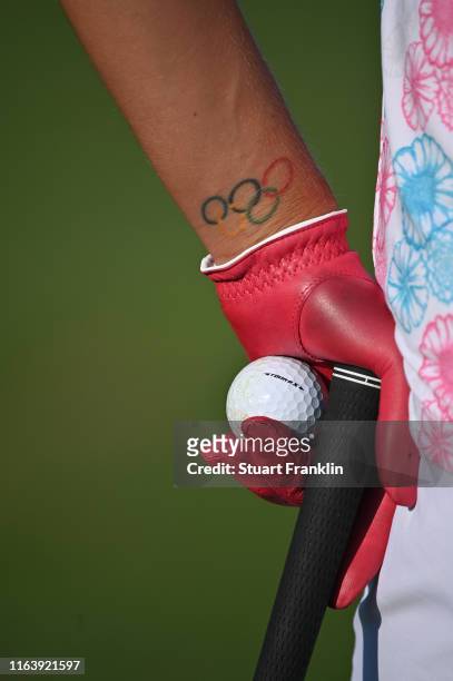 The Olympic tatoo and red golf glove of Lexi Thompson of USA during the pro - am prior to the start of The Evian Championship at the Evian Resort...