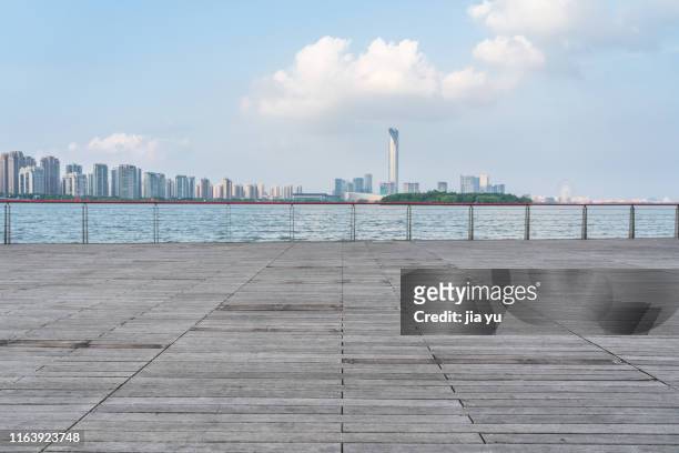 wooden observation platform at urban waterfront - boardwalk ストックフォトと画像
