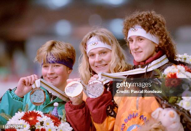 Gunda Niemann of Germany celebrates on the podium after winning the gold medal in the Women's 5000m speed skating competition from silver medallist...