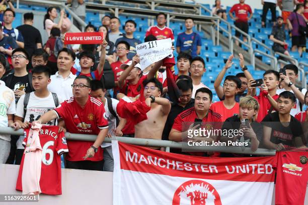 Manchester United fans watch from the stand during a first team training session as part of their pre-season tour of Australia, Singapore and China...