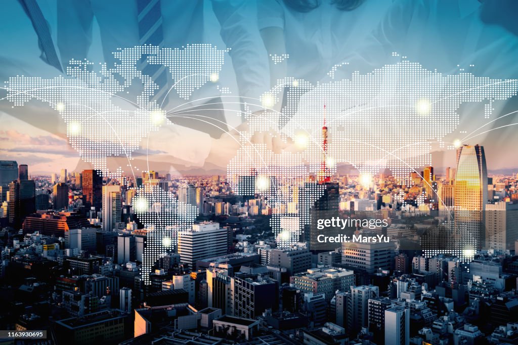 Teamwork with earth map technology abstract in Tokyo