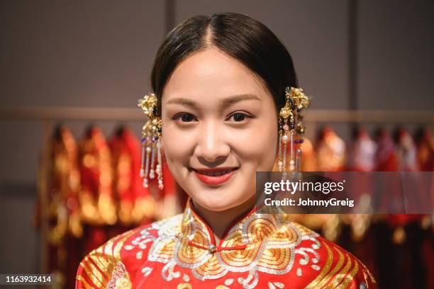 portrait of smiling chinese bride in traditional dress - gold coat stock pictures, royalty-free photos & images