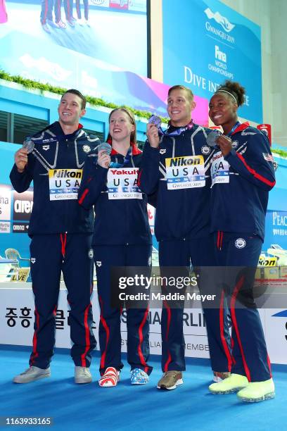 Silver medalists Ryan Murphy, Lilly King, Caeleb Dressel and Simone Manuel of the United States pose during the medal ceremony for the Mixed 4x100m...
