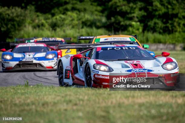 The Ford GT of Richard Westbrook, of Great Britain, and Ryan Briscoe, of Australia, , races on the track during the Northeast Grand Prix, IMSA...